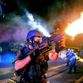 Ferguson Cop firing flashbombs or some goddam thing