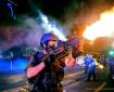 Ferguson Cop firing flashbombs or some goddam thing