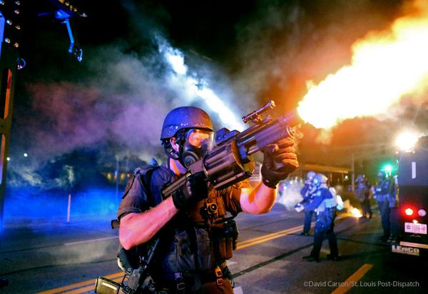 Ferguson Cop firing flashbombs or some goddam thing
