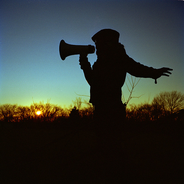 Bullhorn poet speaks to the horizon by lau on Flickr
