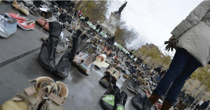 Early Sunday morning, activists with Avaaz set out a sea of donated shoes in the Place de la République, representing the thousands who were outlawed from marching in the streets. (Photo: Joe Solomon)